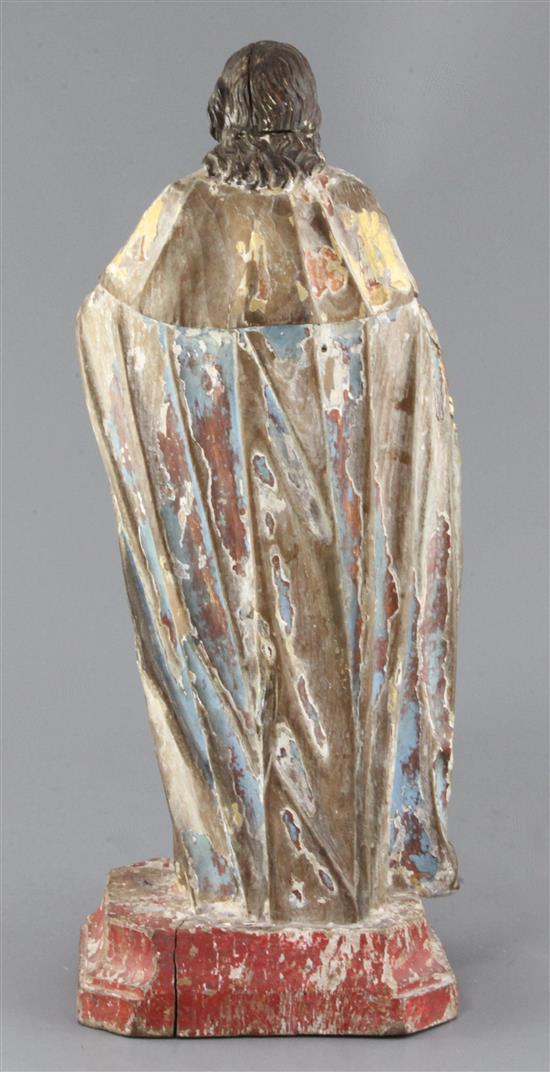 A Brazilian gilt and polychrome-painted carved wood figure of a saint, 18th century, height 17in.